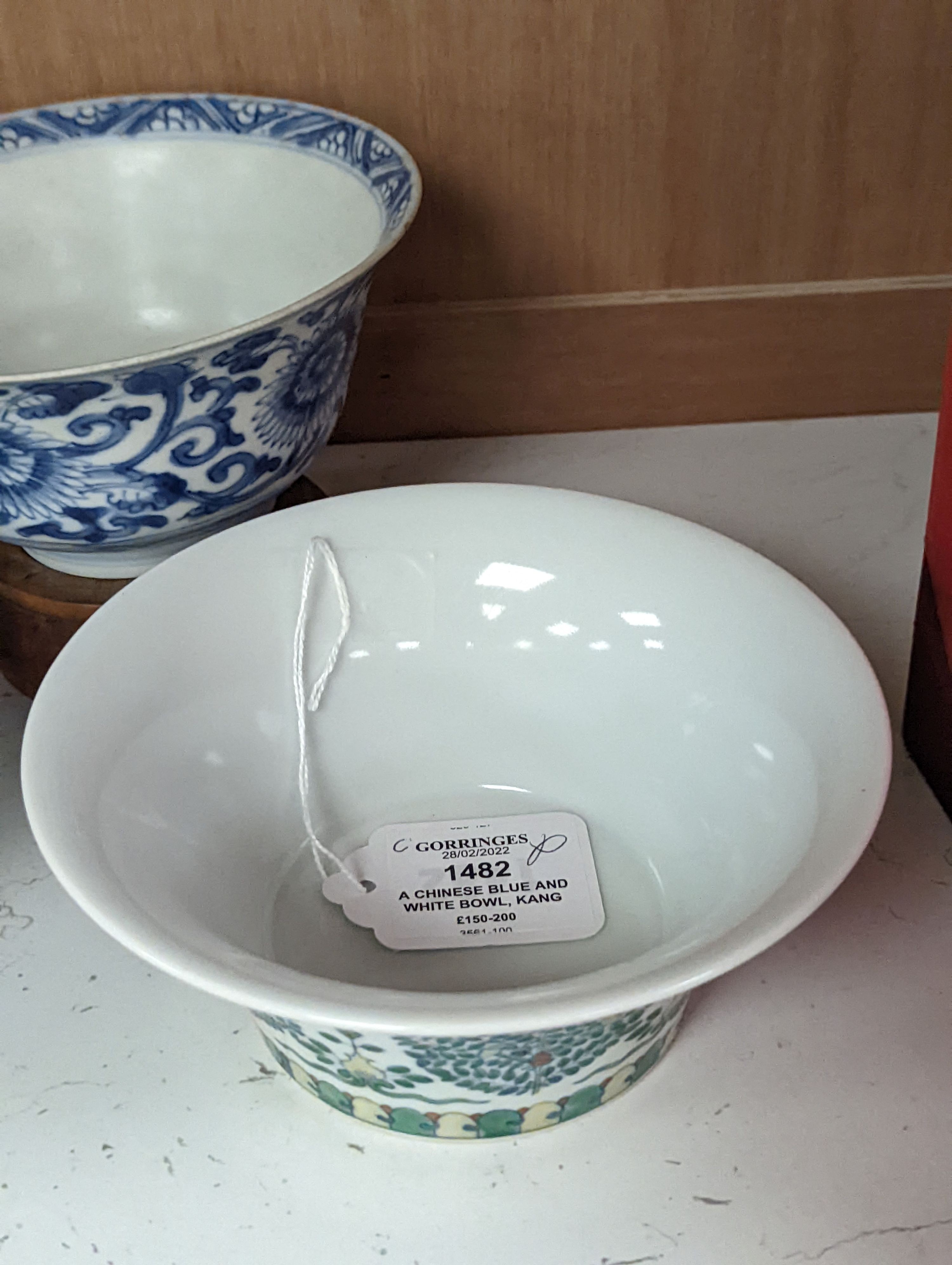 A Chinese blue and white bowl, Kangxi, 15cm. diam., a famille rose teapot stand, Yongzheng, and two doucai bowls